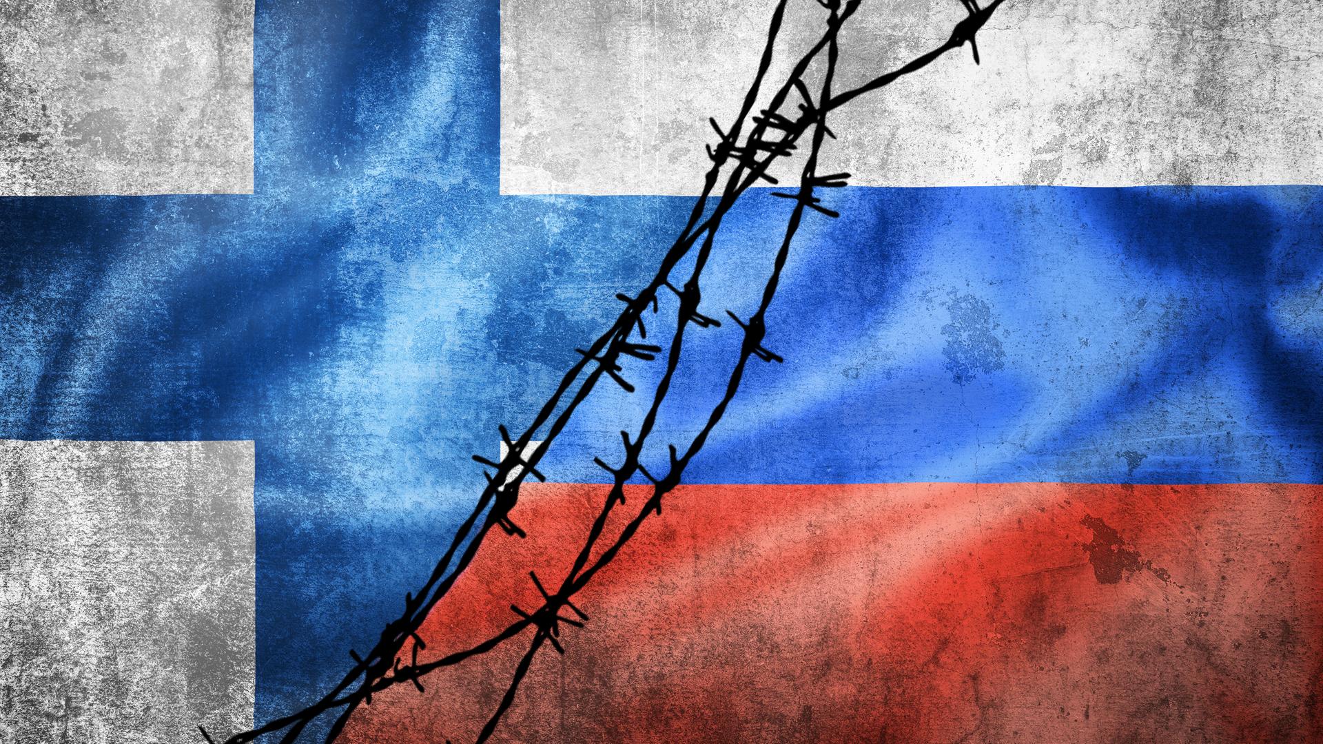Eine Collage der finnischen und russischen Flaggen mit Stacheldraht